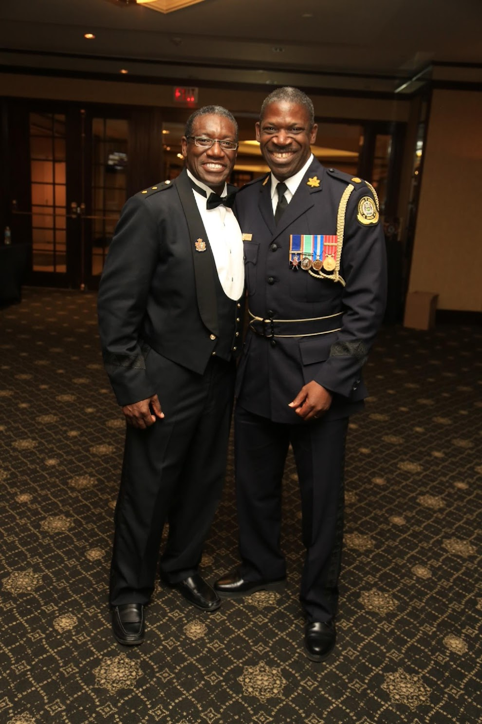 Keith Merith in ceremonial dress uniform alongside a colleague