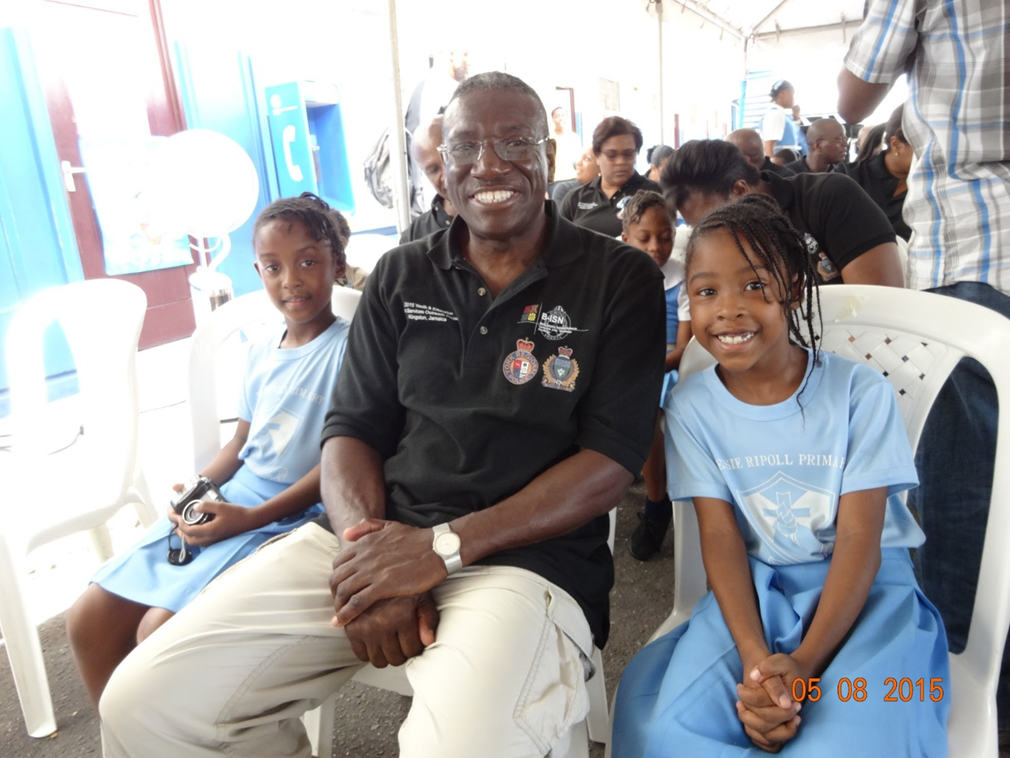 Keith Merith with students during a Youth & Mentorship Outreach trip in Jamaica